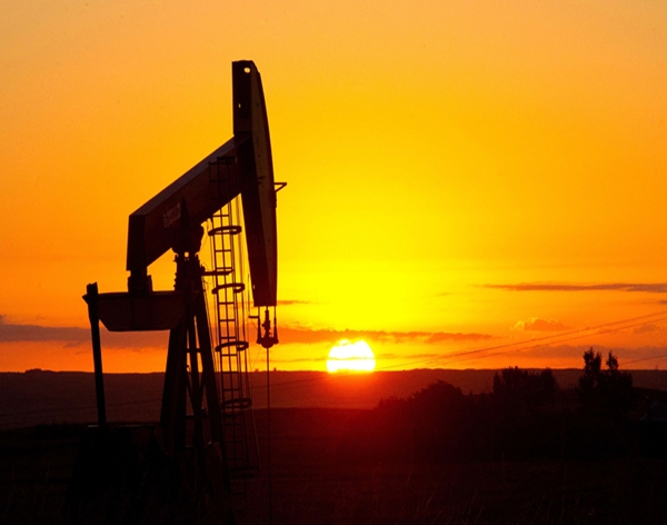 Oil prices edge lower but on track to gain over three percent for the week