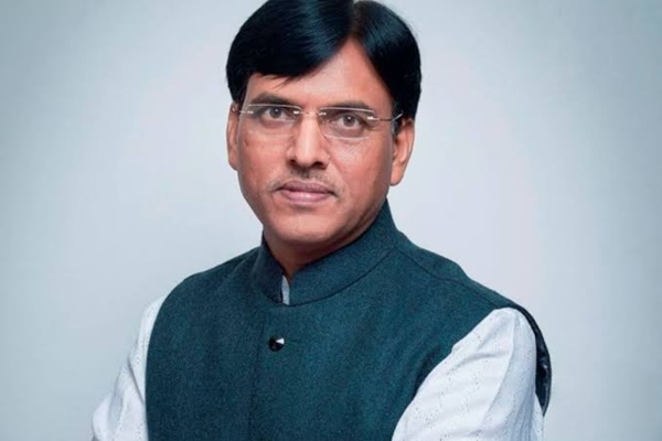 Sports Youth Affairs Minister Dr Mansukh Mandaviya congratulates discus thrower Yogesh Kathuniya for winning silver medal