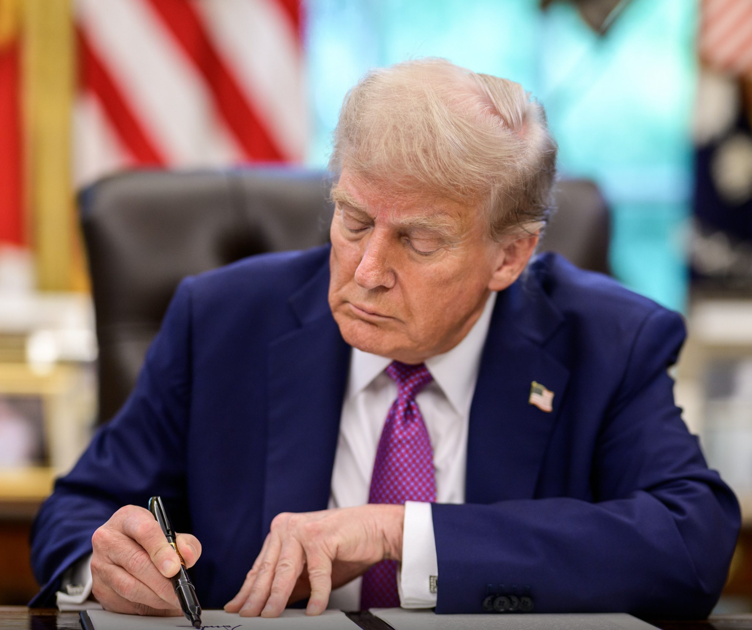 US President Donald Trump signs order renaming Department of Defense the Department of War