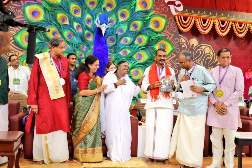 Book Launch: MoS Dr. L Murugan Releases “Same Heart, Same World” During Mata Amritanandamayi’s 72nd Birthday