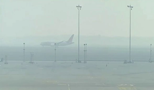 Dense fog engulfs several parts of northern India, disrupts flight and train operations; 64 flights cancelled